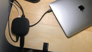 AUKEY CB-C70 Unity Wireless 100W connecting MacBook Pro to its desktop accessories