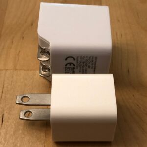 Top: AUKEY PA-Y18 18W PD. Bottom: iPhone 5W USB Power Adapter. Top: AUKEY PA-Y18 18W PD. Bottom: iPhone 5W USB Power Adapter.