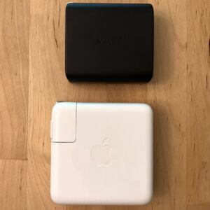 Top: AUKEY PA-D4 60W PD. Bottom: Apple 61W USB-C Power Adapter. Top: AUKEY PA-D4 60W PD. Bottom: Apple 61W USB-C Power Adapter.